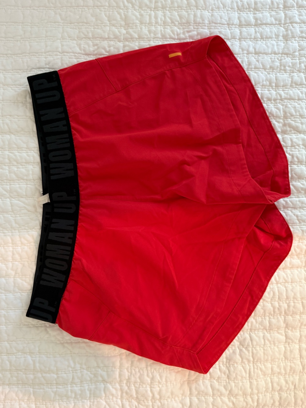 Lucy Red Athletic Shorts with Black WOMAN UP Waistband